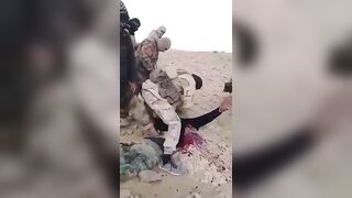 ISIS Terrorists Chop Off A Prisoner's Arm, Then His Head 