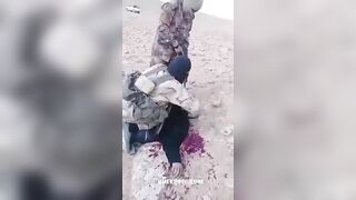 ISIS Terrorists Chop Off A Prisoner's Arm, Then His Head 