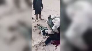 ISIS Terrorists Chop Off A Prisoner's Arm, Then His Head 