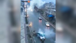 Lightning Strikes A Moving Car, Sending The Entire City Into Chaos
