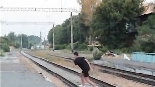 Madman Lying In Front Of Oncoming Train