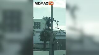 Man Receives Electric Shock While Working On Pole - Video -
