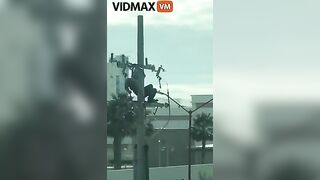 Man Receives Electric Shock While Working On Pole - Video -