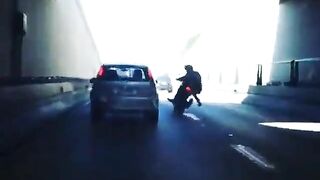 Man Riding Motorcycle Kicks Car While Speeding On Highway