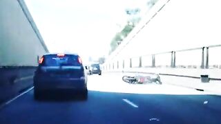 Man Riding Motorcycle Kicks Car While Speeding On Highway