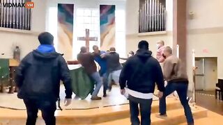 Man Storms Altar As Parishioners Pile On Altar With Dogs During Mass