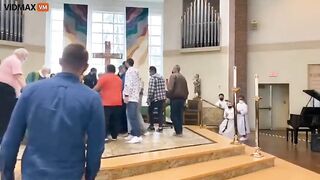 Man Storms Altar As Parishioners Pile On Altar With Dogs During Mass