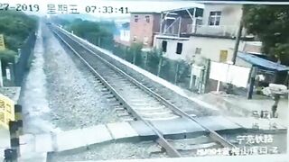 Man On Motorcycle Unable To Overtake Train