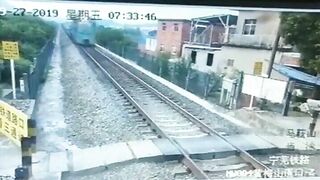 Man On Motorcycle Unable To Overtake Train