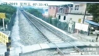 Man On Motorcycle Unable To Overtake Train