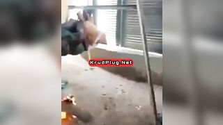 Man Tied To Device Standing Over Fire