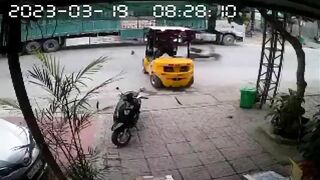 Motorcyclist Falls Headfirst Into Forklift 