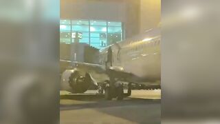 A Passenger Opens The Door And Jumps Onto The Wing At Miami-Dade Airport