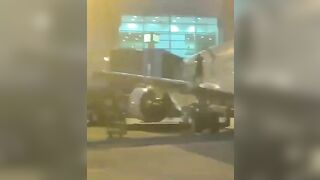 A Passenger Opens The Door And Jumps Onto The Wing At Miami-Dade Airport