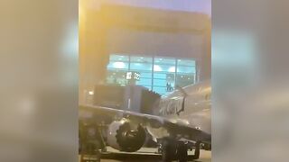 A Passenger Opens The Door And Jumps Onto The Wing At Miami-Dade Airport