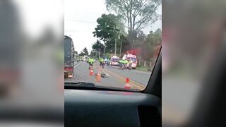 Police Motorcyclist Knocks Down Woman Crossing Road 