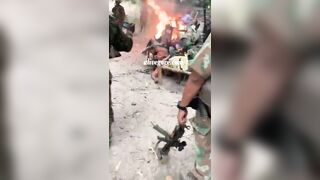 Soldiers Burning Enemy Corpses 