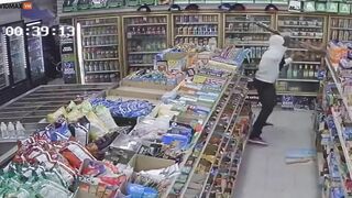 Thug Hits Shop Owner With Baseball Bat During Robbery