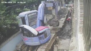 The Wall Collapsed After The Excavator Started, Injuring A Worker