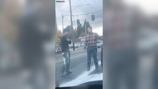 A 'road Rage' Incident Involving An Angry Man Throwing Punches