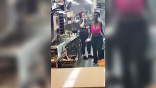 Wild Woman Jumps Over McDonald's Counter And Screams Like B