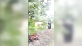 Young Man Holds Machete To Neck