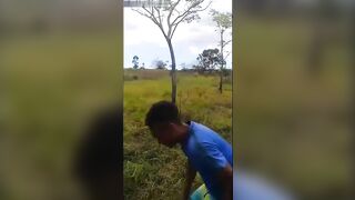 Young Man Holds Machete To Neck