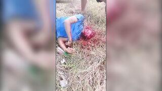 Young Man Holds Machete To Neck