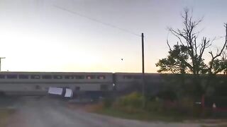 Amtrak Train Hits Semi-truck Transporting A Car