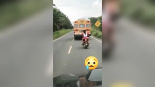 Cycling Couple Tries To Overtake School Bus But Goes Wrong 