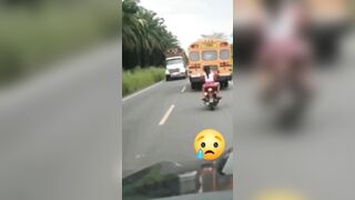 Cycling Couple Tries To Overtake School Bus But Goes Wrong 