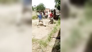 Group Of People Executed With Sticks And Kicks 