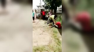 Group Of People Executed With Sticks And Kicks 