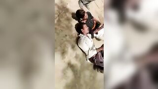 Group Of People Executed With Sticks And Kicks 
