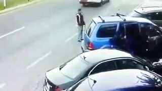 Man Trapped Between Reversing Car And Passing Truck 