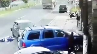 Man Trapped Between Reversing Car And Passing Truck 