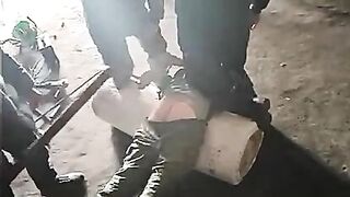 An RU Soldier Sticks A Stick Up A Prisoner's Butt To Analyze Him