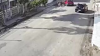 Red Car Hits Biking Couple Head-on 