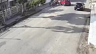 Red Car Hits Biking Couple Head-on 