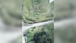 Russian Soldier Hit By Explosion While Crossing Road