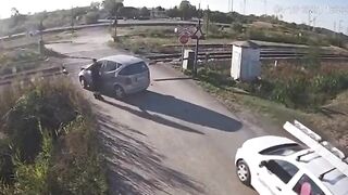 Stupid Driver Tries To Cross Train 