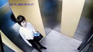Chinese Woman Pours Hot Water For Disabled Person In Elevator