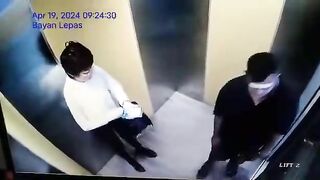 Chinese Woman Pours Hot Water For Disabled Person In Elevator