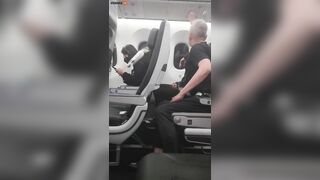 Two Men Punch Each Other On Air Vent During Flight