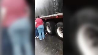 A Few Men Under The Wheels Of A Truck 