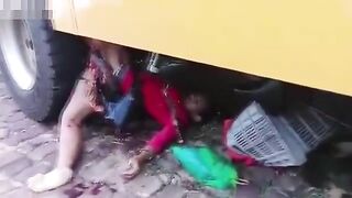 A Woman Shopping Falls Under The Wheels Of A Bus 