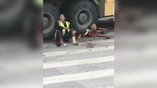 A Crushed Man Looks Out From Under The Steering Wheel Of A Truck 