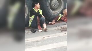 A Crushed Man Looks Out From Under The Steering Wheel Of A Truck 