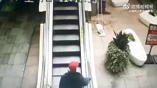 Old Woman Falls And Cannot Climb The Escalator