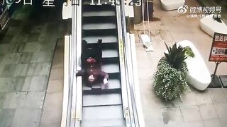 Old Woman Falls And Cannot Climb The Escalator